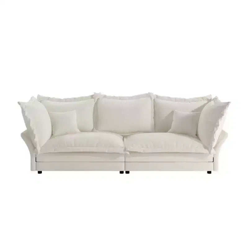 Canapé et méridienne Cloud avec plusieurs oreillers et un design luxueux pour un confort ultime