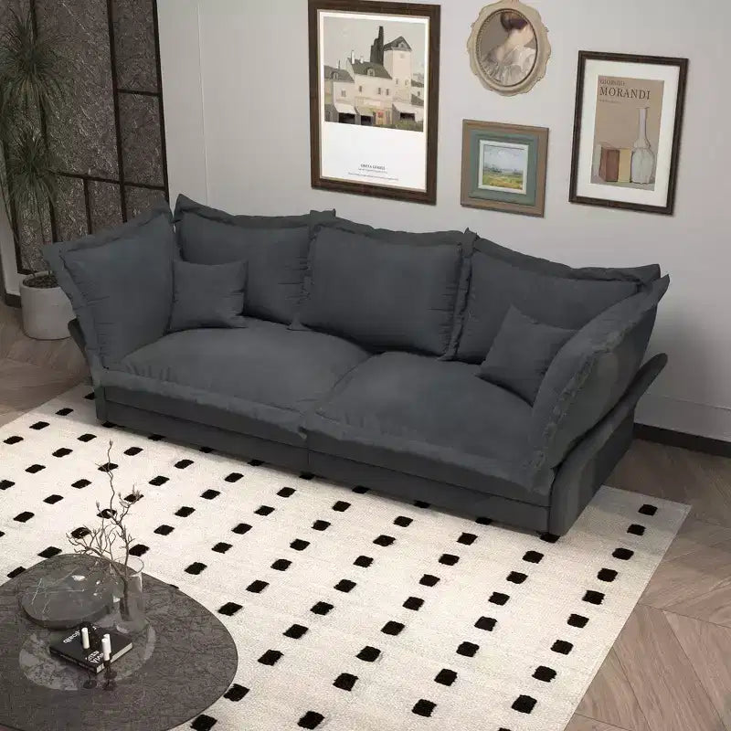 Canapé et méridienne Cloud avec plusieurs oreillers et un design luxueux pour un confort ultime